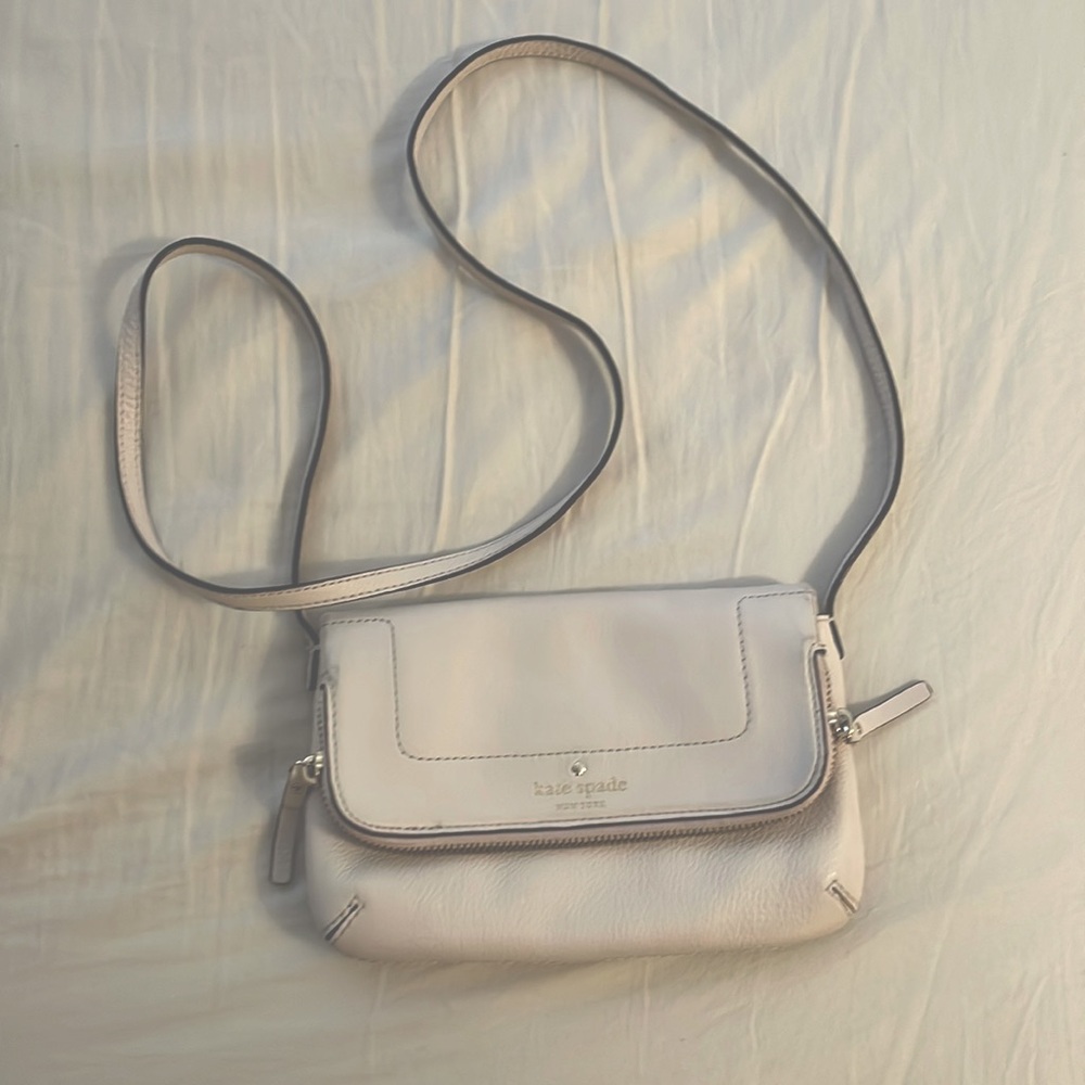 Kate Spade New York small cream colored purse.
